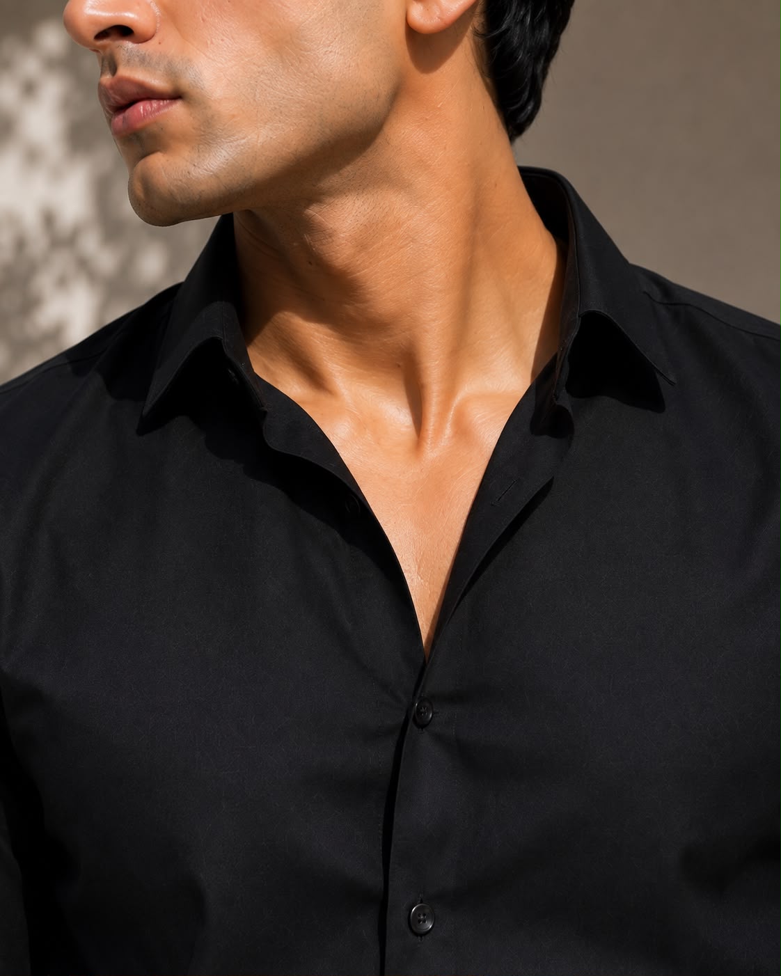 Close-up of black cotton shirt collar detail by Laxurine